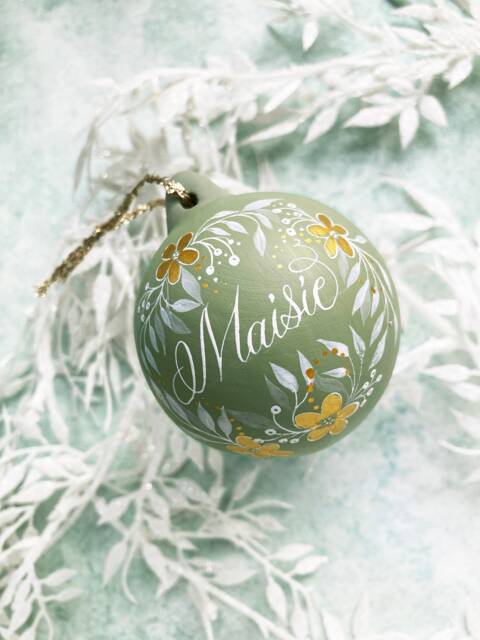 Hand Painted Personalised Ceramic Bauble in Sage Green & Gold With Botanical Illustration