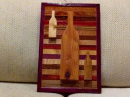 Wood Wall Art Sculpture Featuring 3 Hand Cut Wine Bottle Set in A Variety Of Exotic Hardwood Laminating Strips