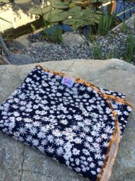 Organic Cotton Knit Baby Blanket Navy Daisies & Butterflies - thumbnail 1