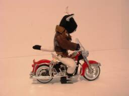A Harley-Davidson Duo-Glide Riding Muslin Bull Doll With A Leather Jacket - 118 Scale