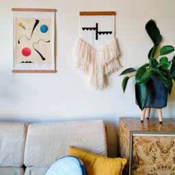 Ojah - Hand Made Wall Hanging With Unique Black Felt Design, Sewn Onto Woven Cotton Fabric, Natural Wool Fringe & Tasmanian Oak Hanger