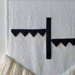 Ojah - Hand Made Wall Hanging With Unique Black Felt Design, Sewn Onto Woven Cotton Fabric, Natural Wool Fringe & Tasmanian Oak Hanger - thumbnail 3