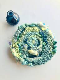 Sparkling Seafoam 10-Inch Round Woven Wall Hanging - thumbnail 1