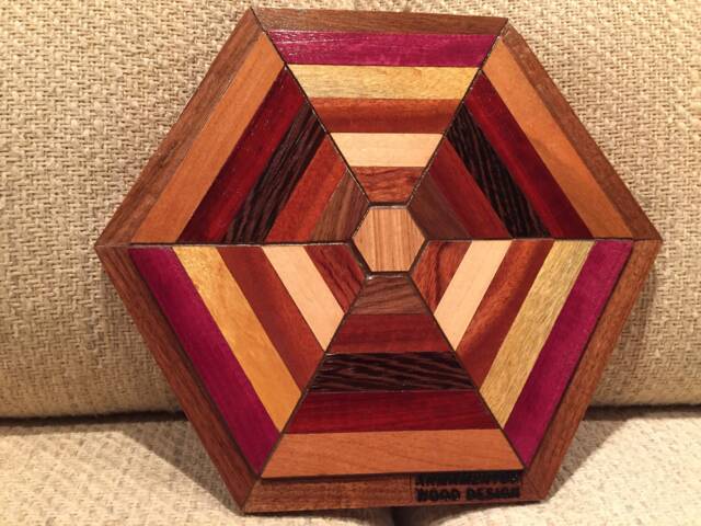 Hexagon Shaped Wood Wall Art Sculpture Featuring A Variety Of Exotic Pieces Geometrically Arrayed - image 1