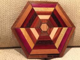 Hexagon Shaped Wood Wall Art Sculpture Featuring A Variety Of Exotic Pieces Geometrically Arrayed