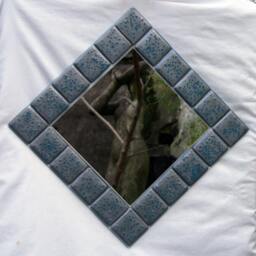 Reactions - A Metallic Pewter Grey Mirror With Steel Blue Accents Fused Onto A Clear Base
