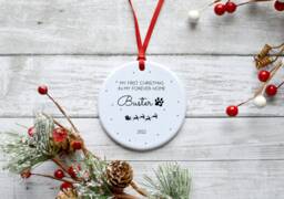 Personalised Dog First Christmas in Forever Home Ceramic Circle Decoration Ornament - thumbnail 1