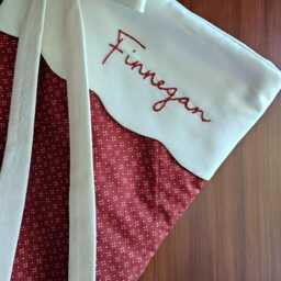 Personalized Quilted Christmas Stocking, Red & Cream Scalloped Cuff With Bow - thumbnail 2