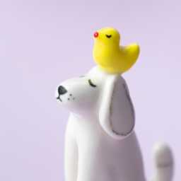 Bantu - Handmade White Porcelain Dog Figurine With Yellow Duck