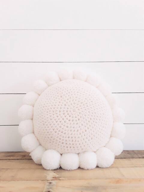 Round Knitted Cushion With White Pompoms - Stockholm - image 1