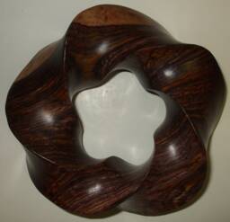 Carved Torus Knots in Wood & Stone - thumbnail 1