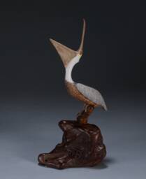 Pelican Sculpture By John Perry Laughing 7In Tall On Polished Burlwood Base - thumbnail 1