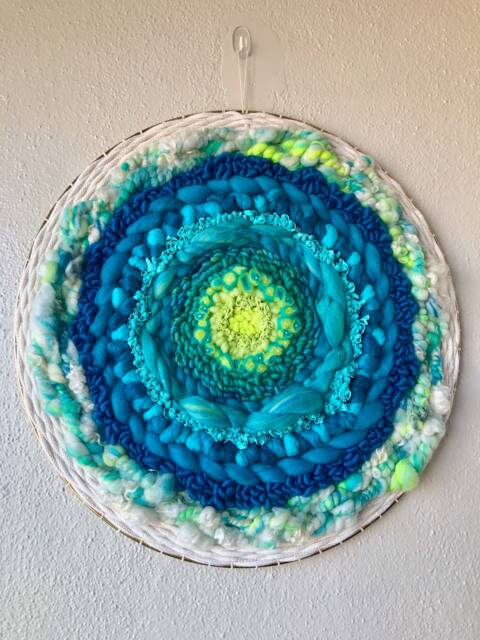 Florescent Sea 19-Inch Round Woven Wall Hanging - image 1