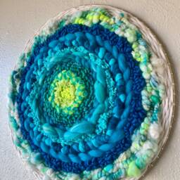 Florescent Sea 19-Inch Round Woven Wall Hanging - thumbnail 3