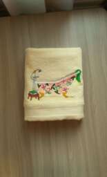A Light Yellow Cotton Terry Towel With Christmas Embroidery Is A Gift For & New Year