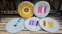 Handfelted Seat Cushion With Coloured Pattern Mix On Light Gray