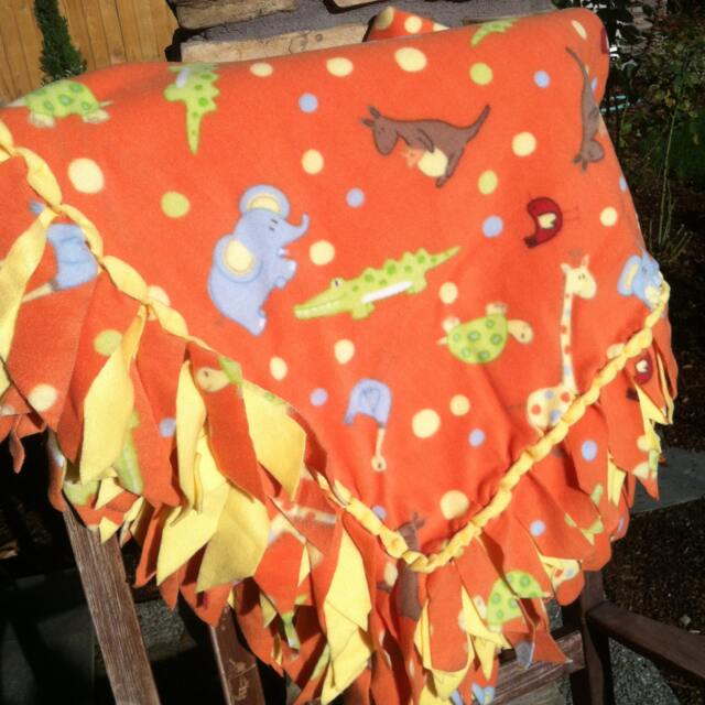 Fleece Blanket - Jungle Animals On Orange With Woven Edge - image 1