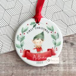 Personalised Baby Babies Baby's First Christmas Boy Girl Newborn Holly Elf Pixie Design Ceramic Round Ornament Keepsake - thumbnail 1