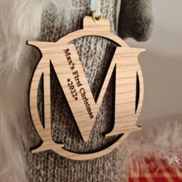 First Christmas Engraved Oak Letter Bauble Decoration - thumbnail 2