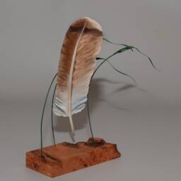 Hand-Carved Red Tail Hawk Feather Suspended By Canary Grass - thumbnail 2