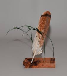 Hand-Carved Red Tail Hawk Feather Suspended By Canary Grass