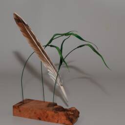 Hand-Carved Red Tail Hawk Feather Suspended By Canary Grass - thumbnail 3