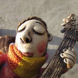 Ceramic Flying Guitarist Wearing A Hand Knitted Striped Scarf - thumbnail 3