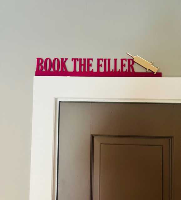Book The Filler Door Topper Funny Clinic Sign With Mirror Syringe - image 1