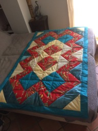 Bedspread Made With Triangles Sewn Drawing Geometrical Figures - thumbnail 1