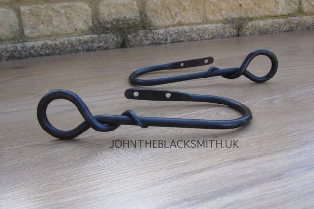 A Pair Of Wrought Iron Curtain Holdbacks With Forged Mouse Tail Finial Ends - image 1