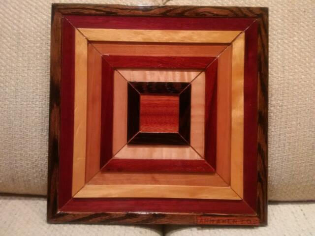 Wood Wall Art Sculpture Featuring A Variety Of Exotic Wood Pieces in Geometric Array - image 1