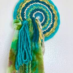 Medusa 8-Inch Round Woven Wall Hanging With Waterfall Fringe - thumbnail 3