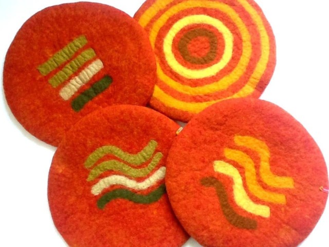 Handfelted Seat Cushion With Coloured Pattern Mix On Orange - image 1