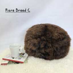 Rare Breed Sheepskin Round Pouffe - Long Wool Foot Stool, Eco-Friendly Home Decor - thumbnail 1