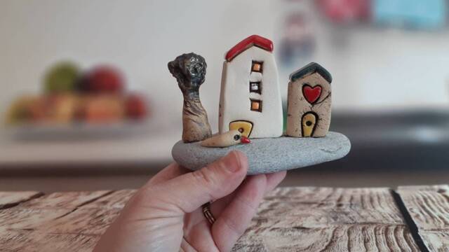 Ceramic Sculpture Of A Whimsical Village With Miniature Clay Houses, Tree & Bird, On Natural Beach Stone - image 1