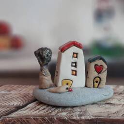 Ceramic Sculpture Of A Whimsical Village With Miniature Clay Houses, Tree & Bird, On Natural Beach Stone - thumbnail 3