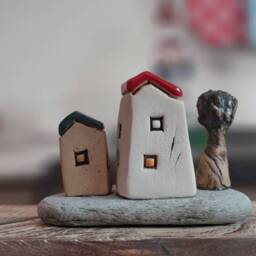 Ceramic Sculpture Of A Whimsical Village With Miniature Clay Houses, Tree & Bird, On Natural Beach Stone - thumbnail 4