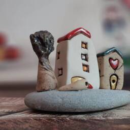Ceramic Sculpture Of A Whimsical Village With Miniature Clay Houses, Tree & Bird, On Natural Beach Stone - thumbnail 2