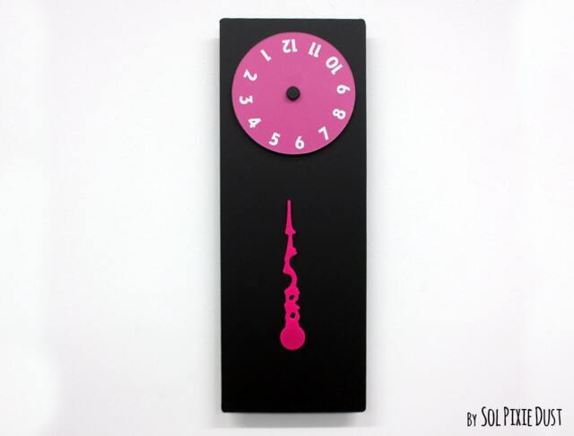 stable Hand, Rotating Numbers - Black Wall Clock - image 1