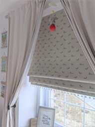 Jumping Hares Blackout Lined Roman Blind With Pom Trim - thumbnail 3