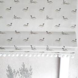 Jumping Hares Blackout Lined Roman Blind With Pom Trim - thumbnail 2