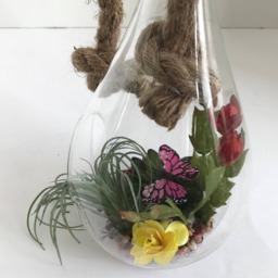 Hanging Glass Vase With Artificial Grass Succulents, Flowering Cactus, Yellow Flowers & Purple Butterfly - thumbnail 2