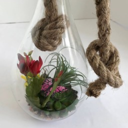 Hanging Glass Vase With Artificial Grass Succulents, Flowering Cactus, Yellow Flowers & Purple Butterfly - thumbnail 3