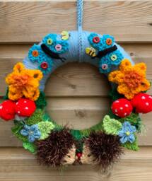Knitted Hedgehog Wreath, Woodland Nursery Decor, Sunflower & Butterfly - thumbnail 1