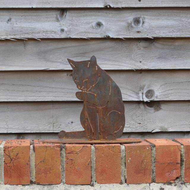Rusty Metal Cat Licking Paw Statue, Garden Art Decor - image 1