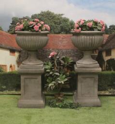Pair Of Royal Sussex Urns On Panel Plinths - thumbnail 1