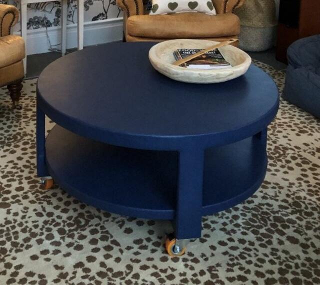 Custom Upholstered Round Table With Shelf