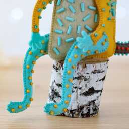 Brawler Bunny - Handmade Felt Sculpture, Whimsical Textile Art, Mischievous Rabbit On A Log - thumbnail 3