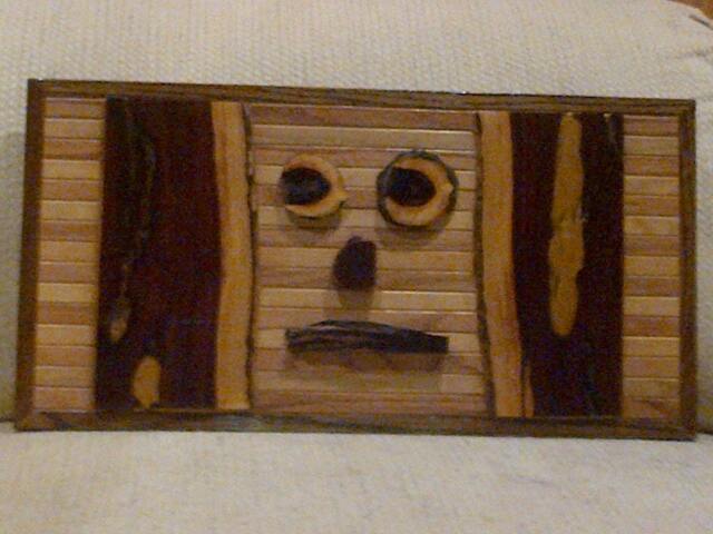 Wood Wall Art Sculpture With Geometric Oak & Pine Stained in Various Colors Accenting Desert Ironwood Sections & Pieces Arrayed As A Face - image 1