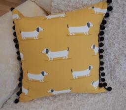 Dog Print Cushion Cotton Fabric With Pom Poms - thumbnail 1
